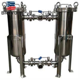 Duplex bag filter housing with valves